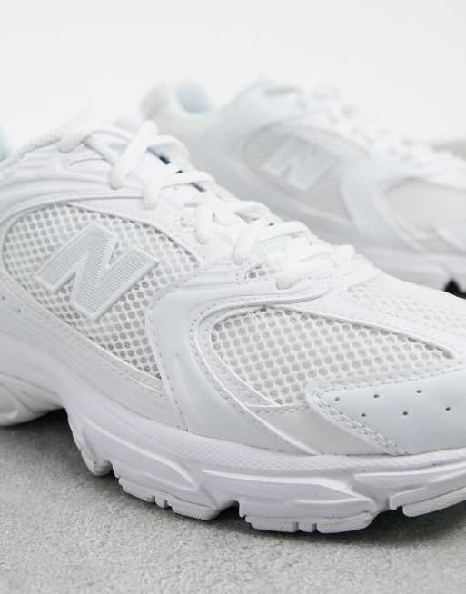 Solid white sale new balance shoes