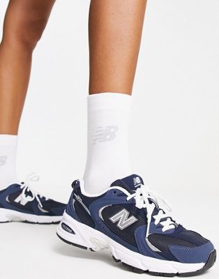 New Balance 530 trainers in navy and 