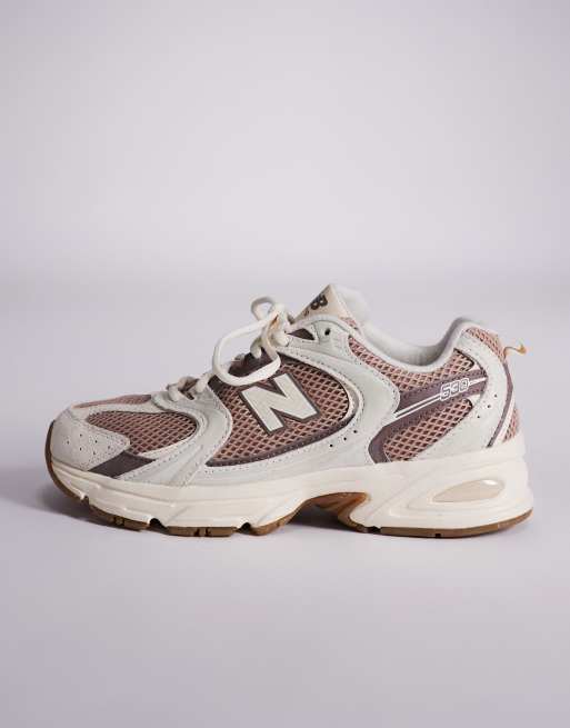 New Balance 530 trainers in white and brown