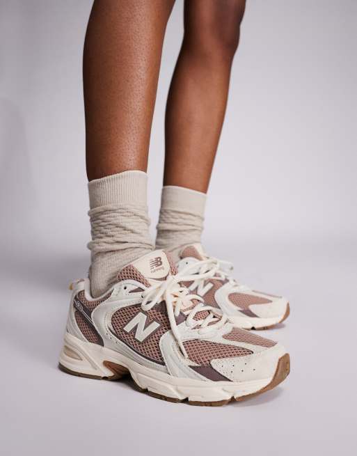 New Balance 530 trainers in white and brown