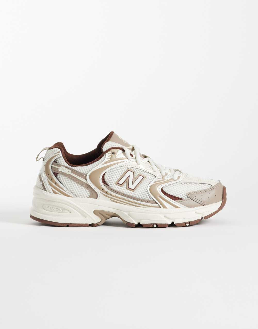 New Balance 530 trainers in white and brown
