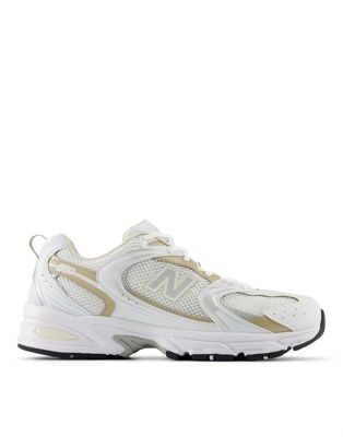 New Balance 530 trainers in white and gold