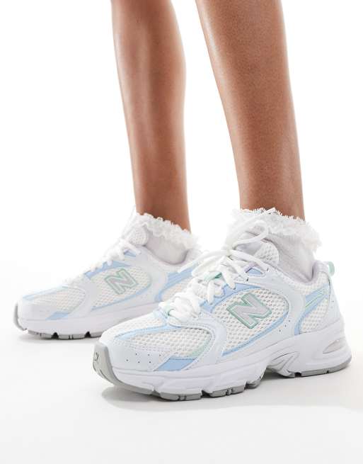 New Balance 530 trainers in white and light blue