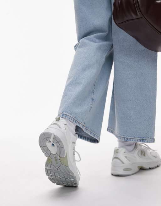 New Balance 530 trainers in white and light green