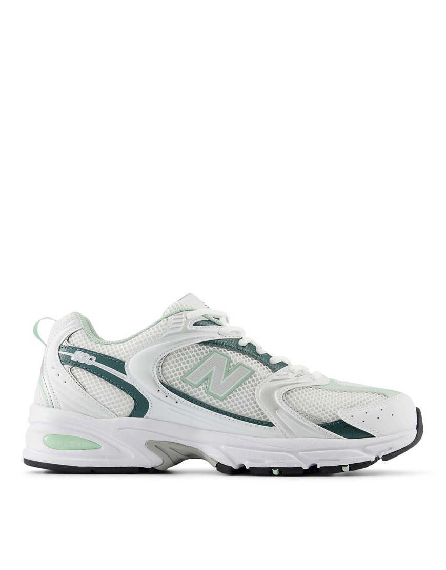 New Balance 530 trainers in white and metallic green