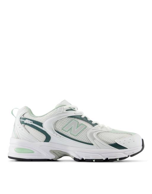  New Balance 530 trainers in white and metallic green