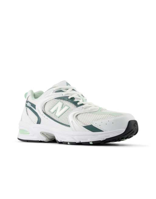 New Balance 530 trainers in white and metallic green, 3 of 4