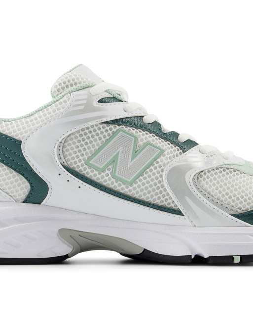 New Balance 530 trainers in white and metallic green ASOS