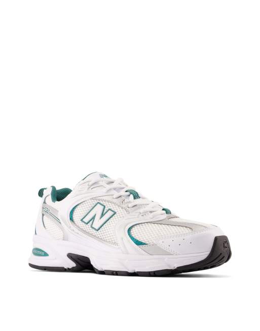 New Balance 530 trainers in white and metallic with teal detailing  , 2 of 4