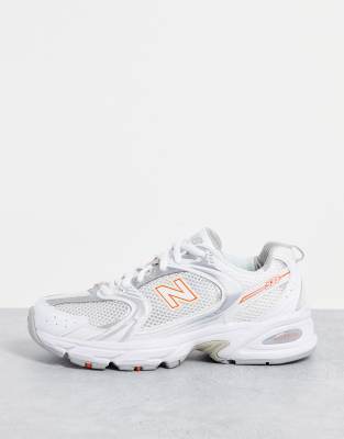 new balance 530 trainers in white and peach