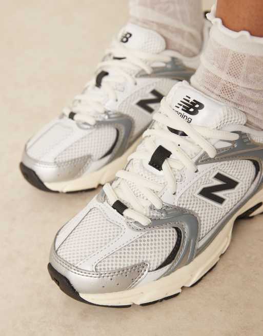 New Balance 530 trainers in white, black and silver, 4 of 5