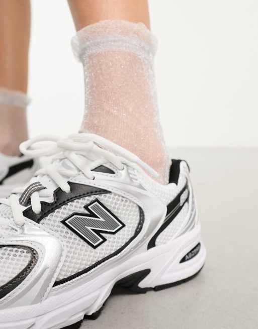 New Balance 530 trainers in white & black