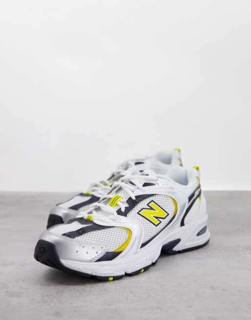 New Balance 530 trainers in white yellow and navy