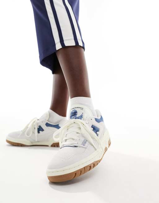 New Balance 550 gum sole sneakers in white with denim blue