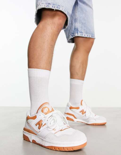 New Balance 550 sneakers in white and orange