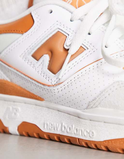 New Balance 550 sneakers in white and orange