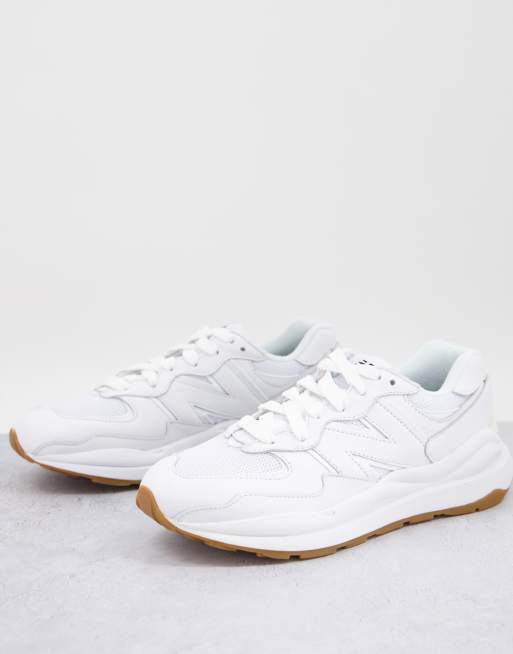 New Balance 574 sneakers in triple white with gum sole