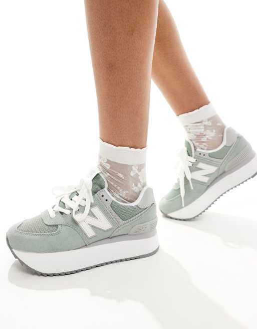 New Balance 574+ platform sneakers in green with gray and white detail