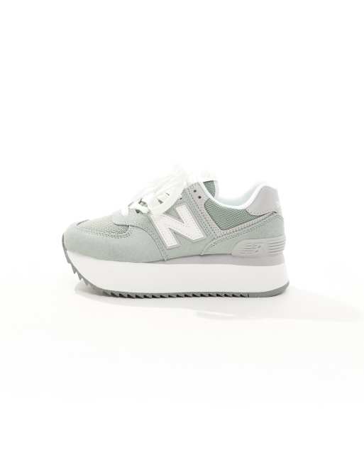 New Balance 574+ platform sneakers in green with gray and white detail