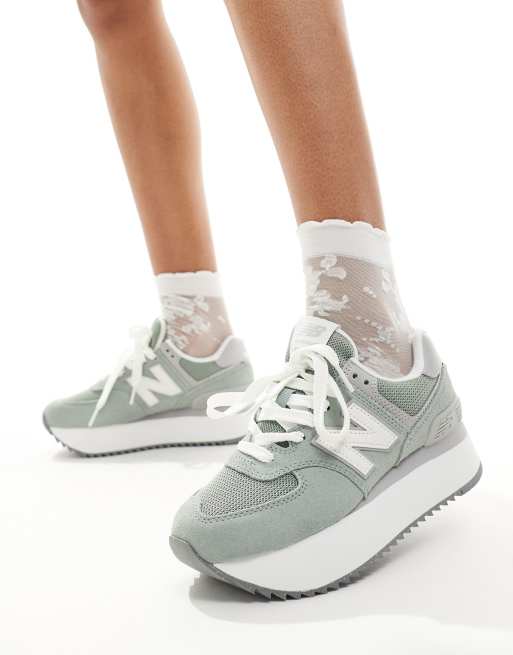 New Balance 574+ platform sneakers in green with gray and white detail