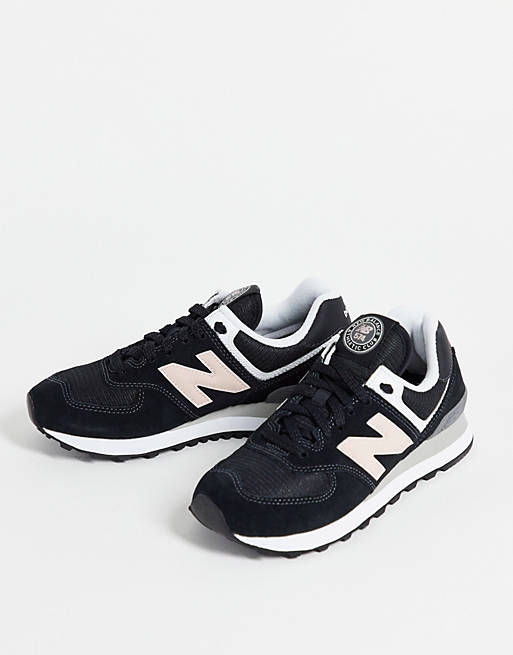New Balance 574 sneakers in black and pink