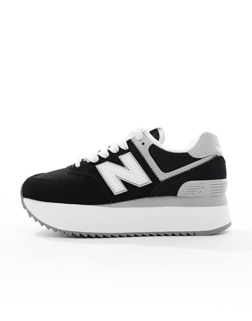 New Balance 574 sneakers in black with white and gray detail