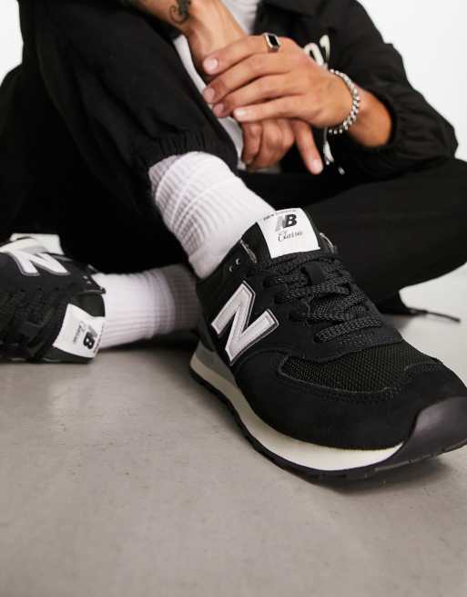 New Balance 574 sneakers in black with white detail ASOS