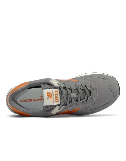 New Balance 574 Sneakers in grijs en oranje