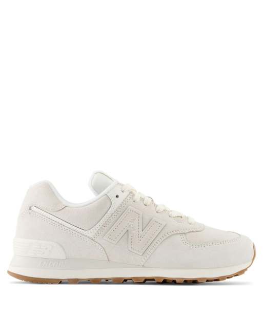 New Balance 574 sneakers in triple white with gum sole