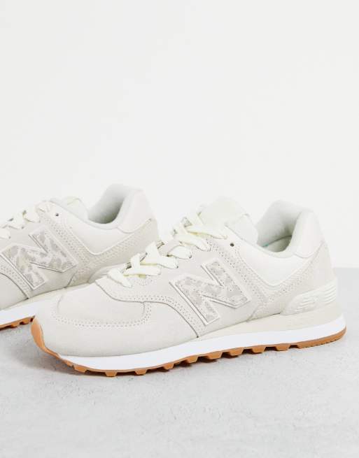 New Balance 574 sneakers in white and animal print