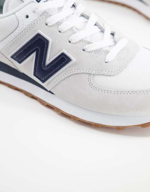 New Balance 574 sneakers in white and navy