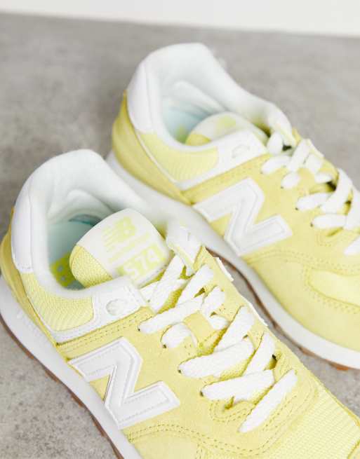 New Balance 574 sneakers in yellow and white