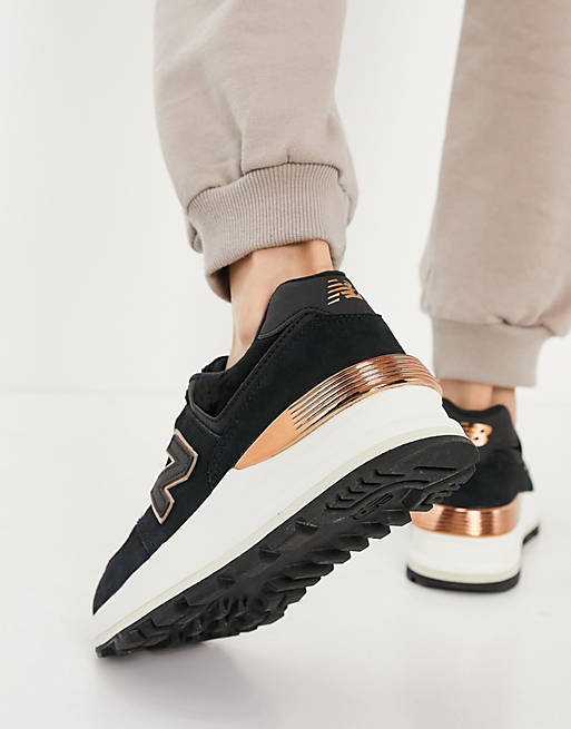 New Balance - 574 - Sneakers nere e oro rosa con zeppa