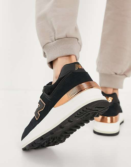 New Balance - 574 - Sneakers nere e oro rosa con zeppa New Balance - 574 - Sneakers nere e oro rosa con zeppa