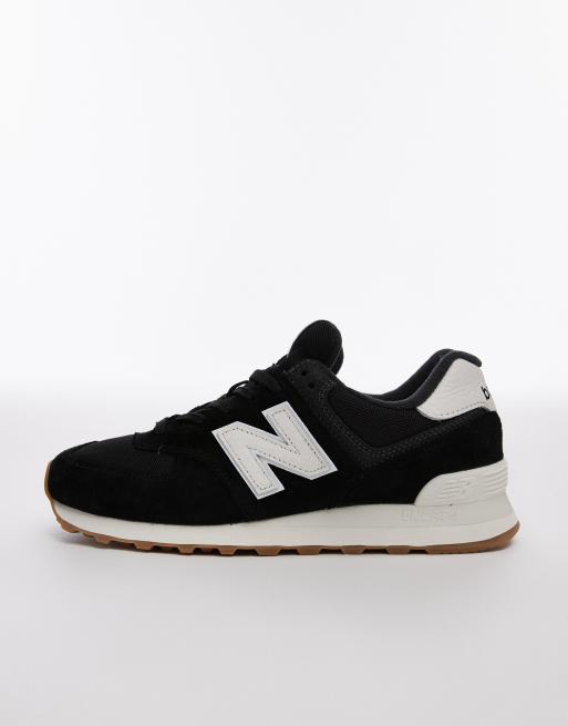 New Balance 574 trainers in black and white ASOS