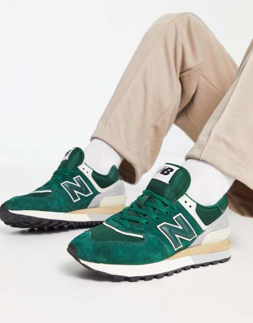 New Balance 574 trainers in dark green and off white