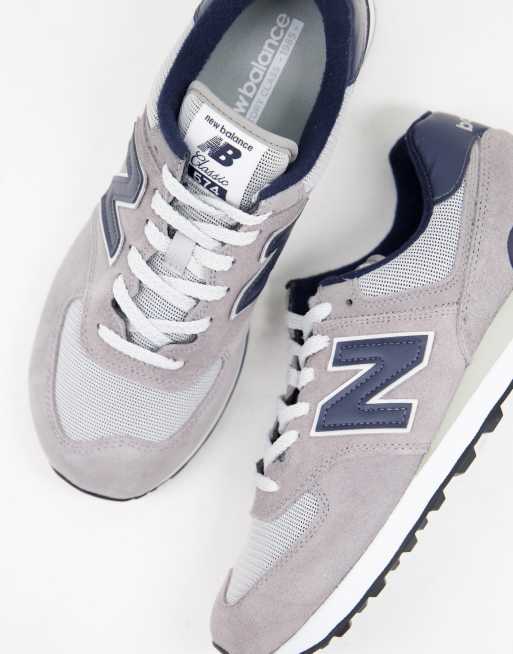 New Balance 574 trainers in grey and navy