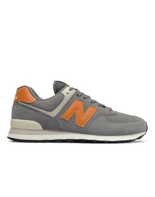 New Balance 574 trainers in grey and orange