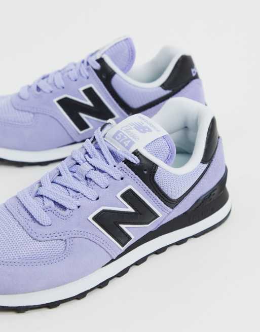 New Balance 574 trainers in lilac and black