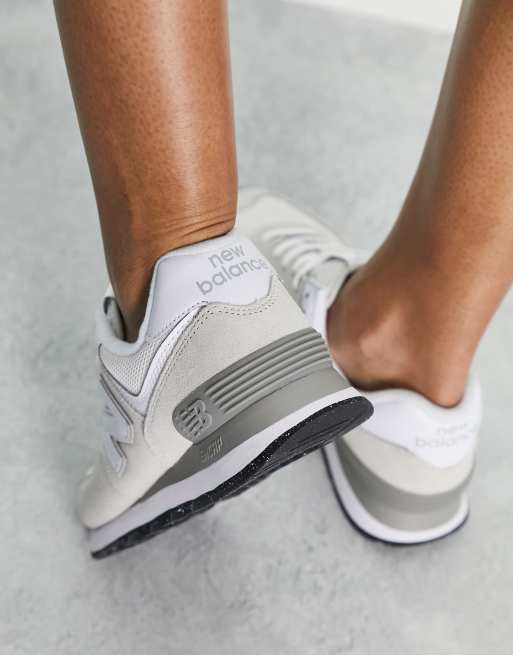 New Balance 574 trainers in metallic white and silver