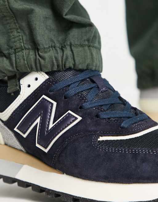 New Balance 574 trainers in navy and off white