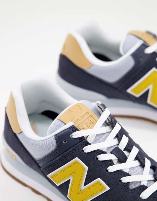 New Balance 574 trainers in navy/yellow