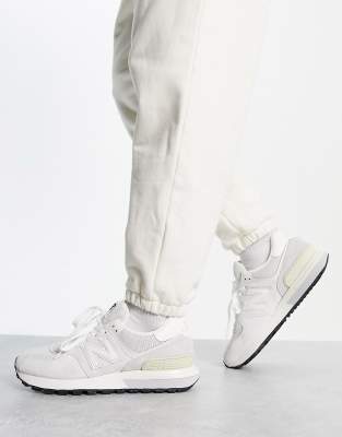 New Balance 574 trainers in off white and grey | The Hoxton Trend