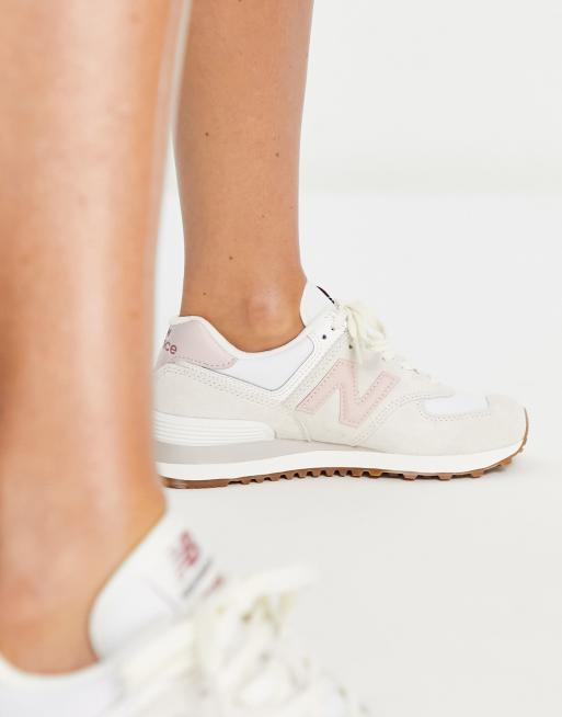 New Balance 574 trainers in white and pink