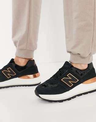 new balance black & gold 574 suede trainers