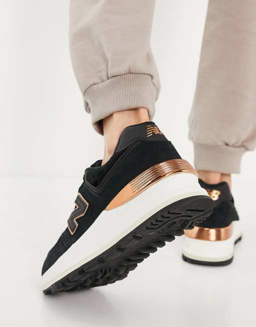 New Balance 574 wedge trainers in black rose gold