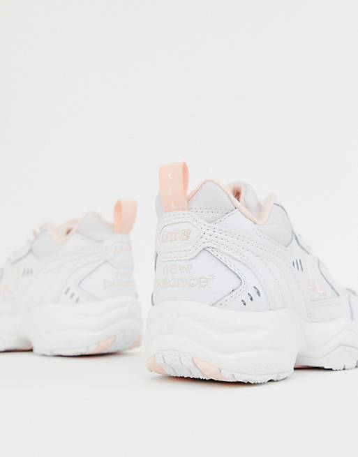New Balance 608 trainers in white and pink