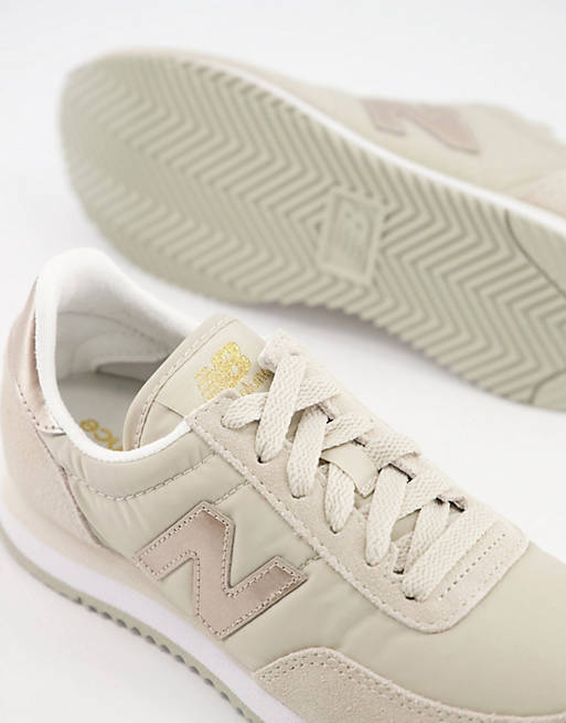 New Balance 720 sneakers in pink/gold