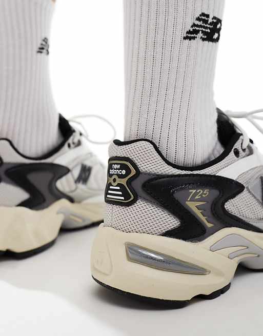 New Balance 725 sneakers in gray with navy and yellow details New Balance 725 sneakers in gray with navy and yellow details