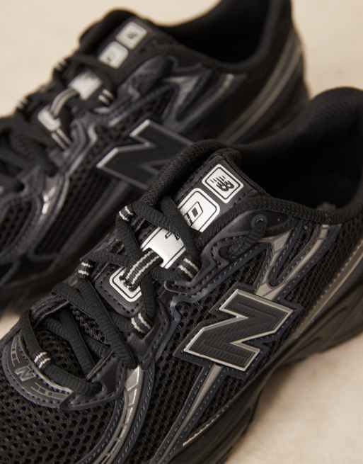 New Balance 740 trainers in black and silver metallic